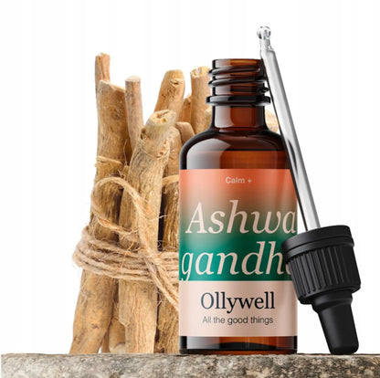 Butelka ekstraktu Ashwagandha Ollywell obok wiązki suszonych korzeni i szklanej pipety na białym tle.