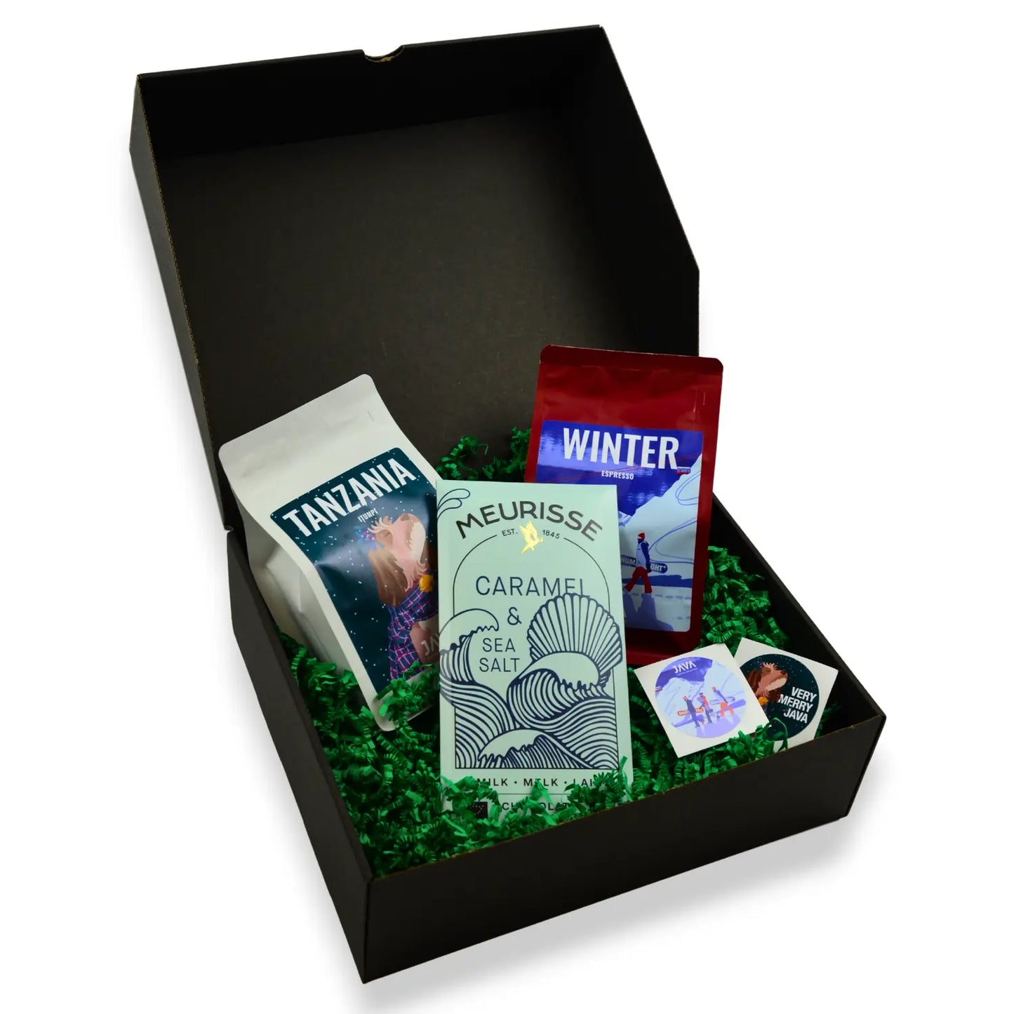 Świąteczny zestaw prezentowy JAVA Coffee z kawami Tanzania i Winter Espresso oraz czekoladą Meurisse w czarnym pudełku z zielonym wypełnieniem.